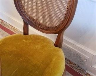 1 of 6 Dining Chairs upholstered in gold velour with canned backs.