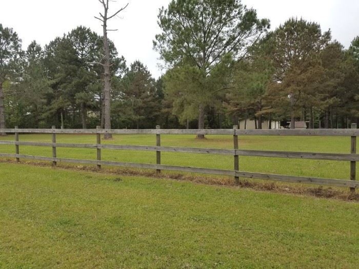 Property is fenced and gated along road side.
