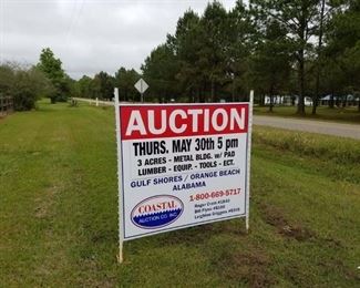 Auction sign posted on Nelson Lane at entrance