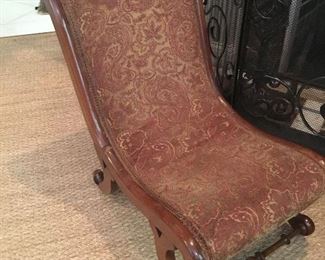 Antique Sleeper fireside chair on casters