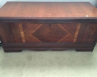 Antique cedar chest with inlaid wood.

