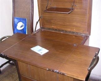 This piece of mid-century furniture is called "Little Home Office". What an awesome piece! It folds down into a side table! Excellent condition.