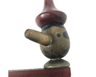 Lot 006 
Antique Pinocchio Spinning and Clicking Toy