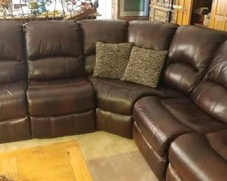 Dark brown leather sectional with 4 recliners