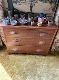 Antique dresser and pottery.