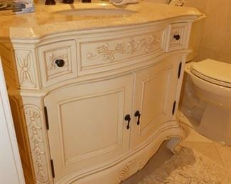 Bombe style bathroom vanity with stone top
