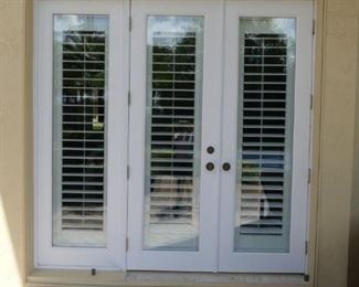 Exterior view of impact French doors with sidelight and attached Bahama shutters (3 available)