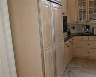 Side view of fridge and some cabinets
