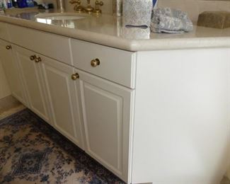 White bathroom paneled vanity cabinets