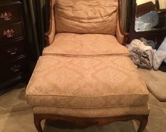 Upholstered chair with ottoman