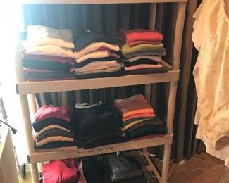 More folded sweaters, T-shirt’s, etc, along these shelves