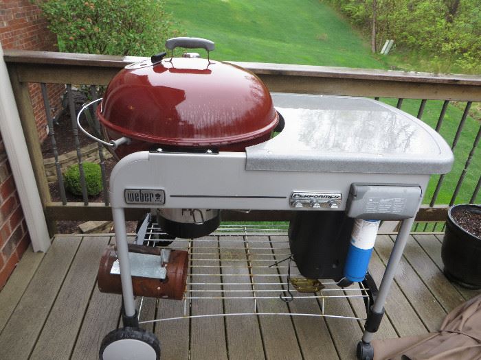 Newer Weber grill with a gas starter.