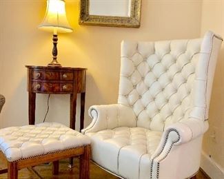 White leather tufted wing chair with hobnail detail.  Matching ottoman