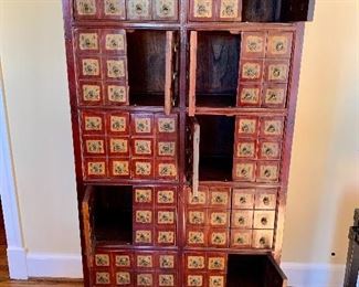 Red cabinet with multiple doors