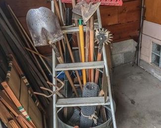 White ladder and yard tools