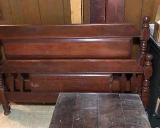 small trunk and full size bed with rails
