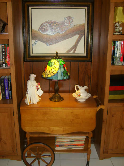 tea cart, oil painting by George Arrieta, and Tifany style lamp