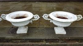 Pair of white French antique cast iron urns