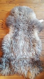 We have about 7 of these extra large, gorgeous shearling rugs -- clean and in excellent condition! 2 grey and several white! These can retail in specialty stores for well over $100. Throw one over your favorite club chair for instant glamour!
