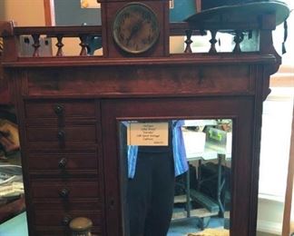 Antique Eclipse Silk Cabinet with clock and storage drawers...it's crowned with a Beaver top hat.