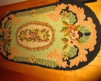 Antique floral hooked rug
