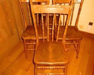 Group of four oak pressed back chairs circa 1900