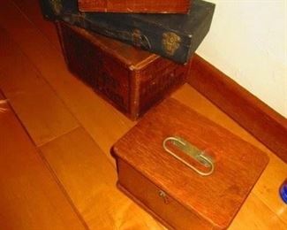 A group of boxes and antique medical equipment