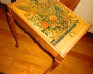 A hand constructed side table with a vintage botanical