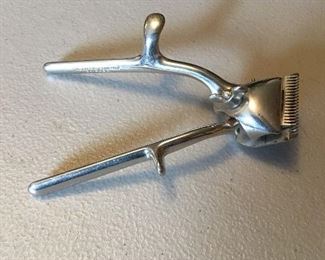 Hand operated hair clippers.