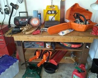 Chainsaw, hedge trimmers, radios, workbench