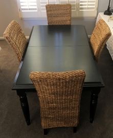 Pottery Barn Rattan Chairs and Black Dining Table