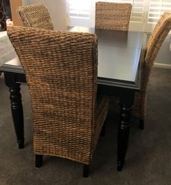 Pottery Barn Rattan Chairs and Black Dining Table