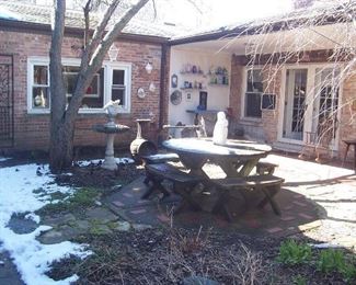 THE GARDEN COURTYARD IS FULL OF OUTSIDE INTERESTING ITEMS