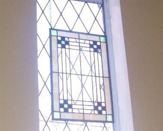 THERE ARE SEVERAL PIECES OF STAINED GLASS