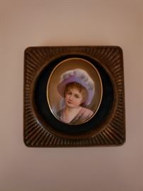 A lady's brooch containing a oval portrait miniature mounted in a newer frame, late 19th century
