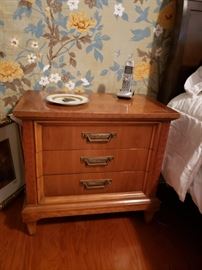 One of a pair of Thomasville Furniture Co. three drawer nightstands