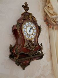 Bucherer enamel painted clock on shelf