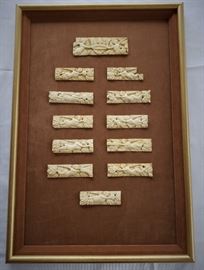 Set of twelve carved bone panels of angles