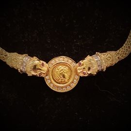 18k yellow gold coin necklace with small round diamonds and four rubies