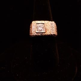 14k yellow gold diamond ring with center stone weighing approximately .75 carat and 8 single cut small round diamonds