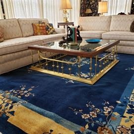 Pair of sofas, brass and glass square coffee table with wood trim and Chinese room rug
