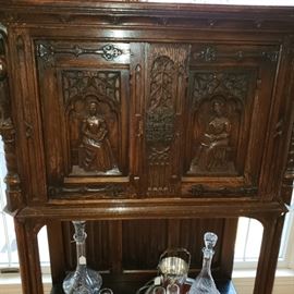 French Gothic style carved oak cabinet on stand