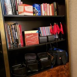 Collection of vintage Polaroid cameras and books