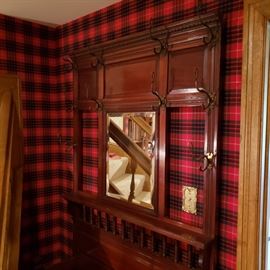 Top of hall tree has hooks and center mirror