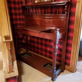 Base of hall tree has copper inserts for wet umbrellas