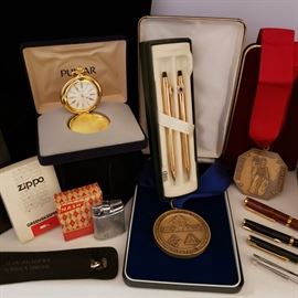 Collection of pens, medals and more