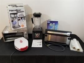 group of various kitchen appliances, FoodSaver, toaster oven, coffee maker, immersion blender, https://ctbids.com/#!/description/share/146731 
