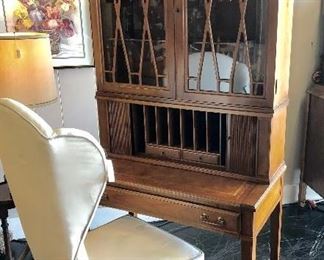 Antique Secretary with glass doors and leather top, with a mid-century modern white chair