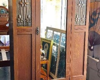 EXQUISITE, Antique English Armoire with hammered tin pieces on each side of the mirrored door, and one bottom drawer. 