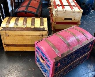 Four different antique trunks